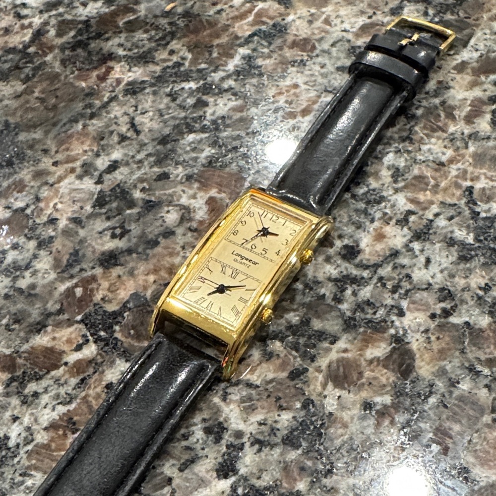 Gold and Black Dual Face Watch.